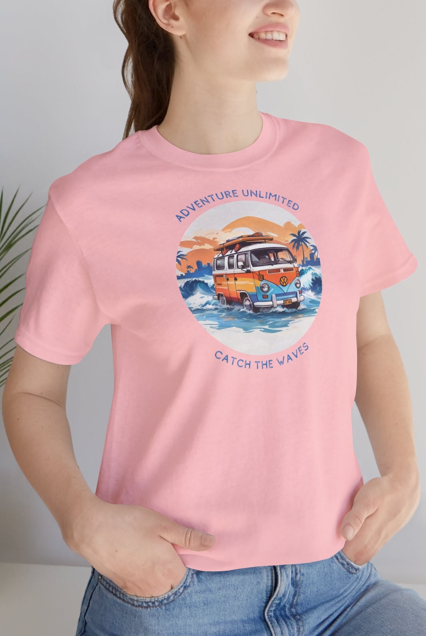 Woman wearing pink Adventure Unlimited direct-to-garment printed surfing t-shirt by Soulshinecreators
