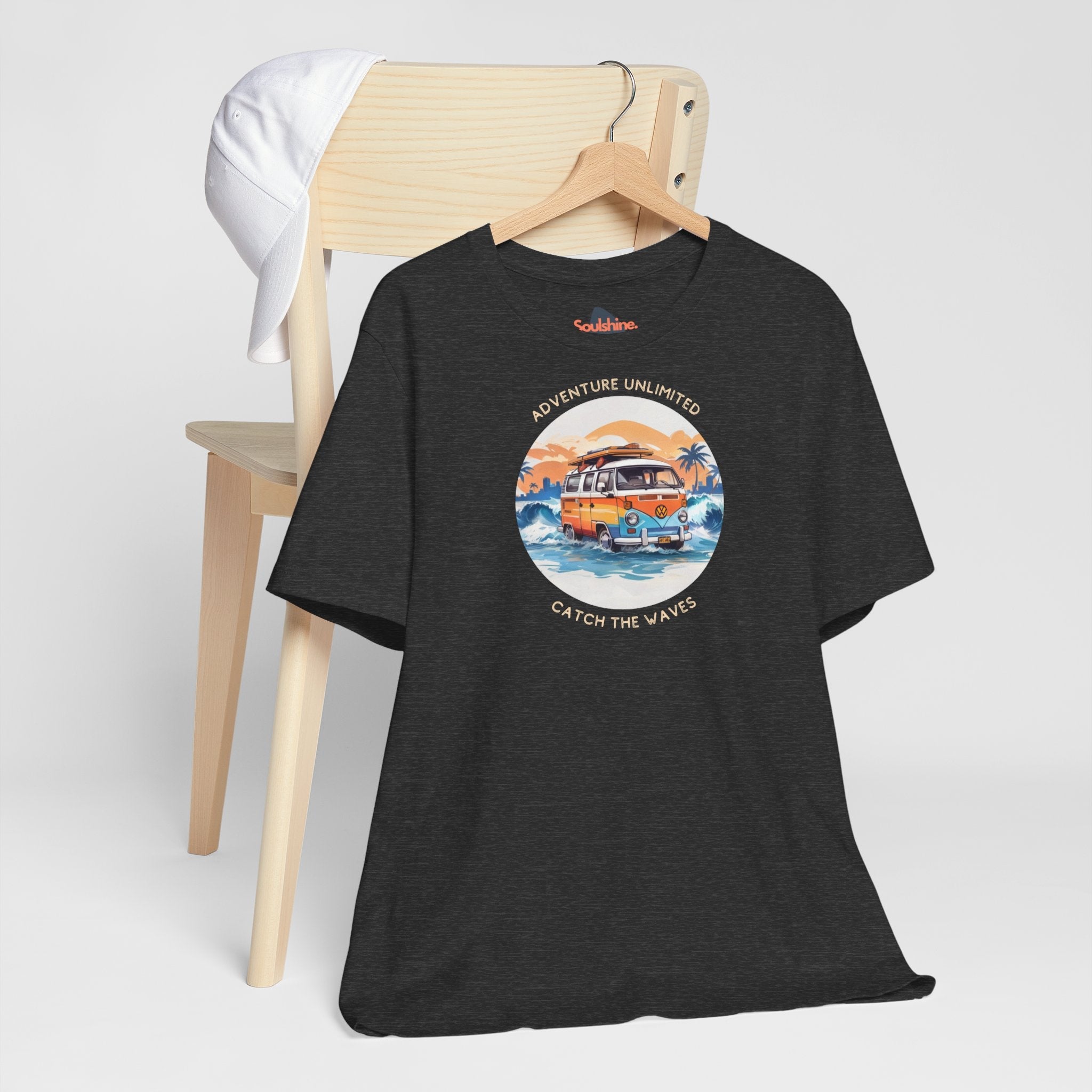 Adventure Unlimited Surfing T-Shirt featuring a van and sunset graphic printed on a black Bella & Canvas EU item